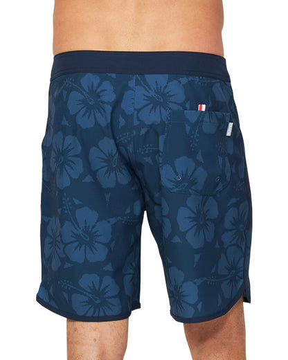 A close up back view of the Okanui Boardrider Boardshorts featuring the back pocket and Hibiscus flower prints.