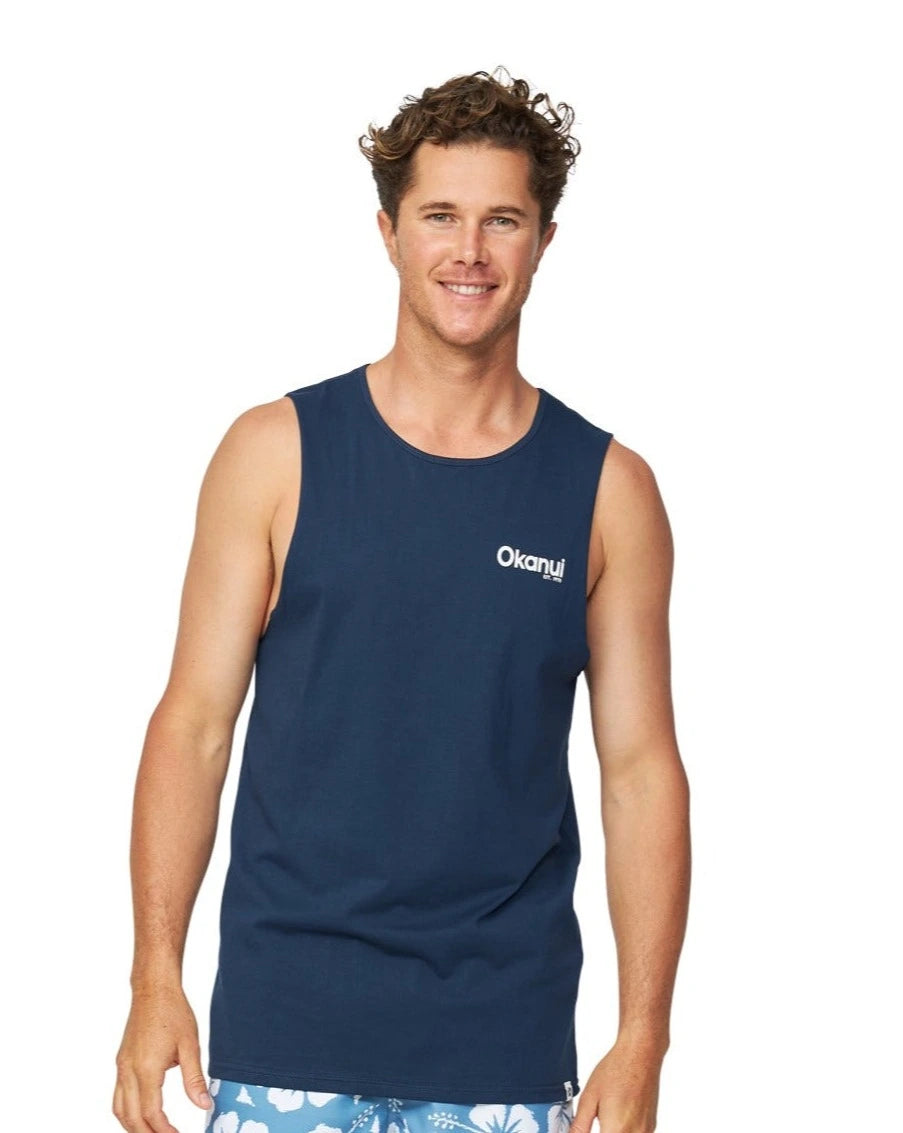 A front view of the Okanui Classic Badge Tank top for men in navy colour featuring the Okanui logo on the left chest.