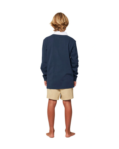 Full body back view of a boy wearing the Okanui Heritage long sleeve rugby tops and jumpers in Navy