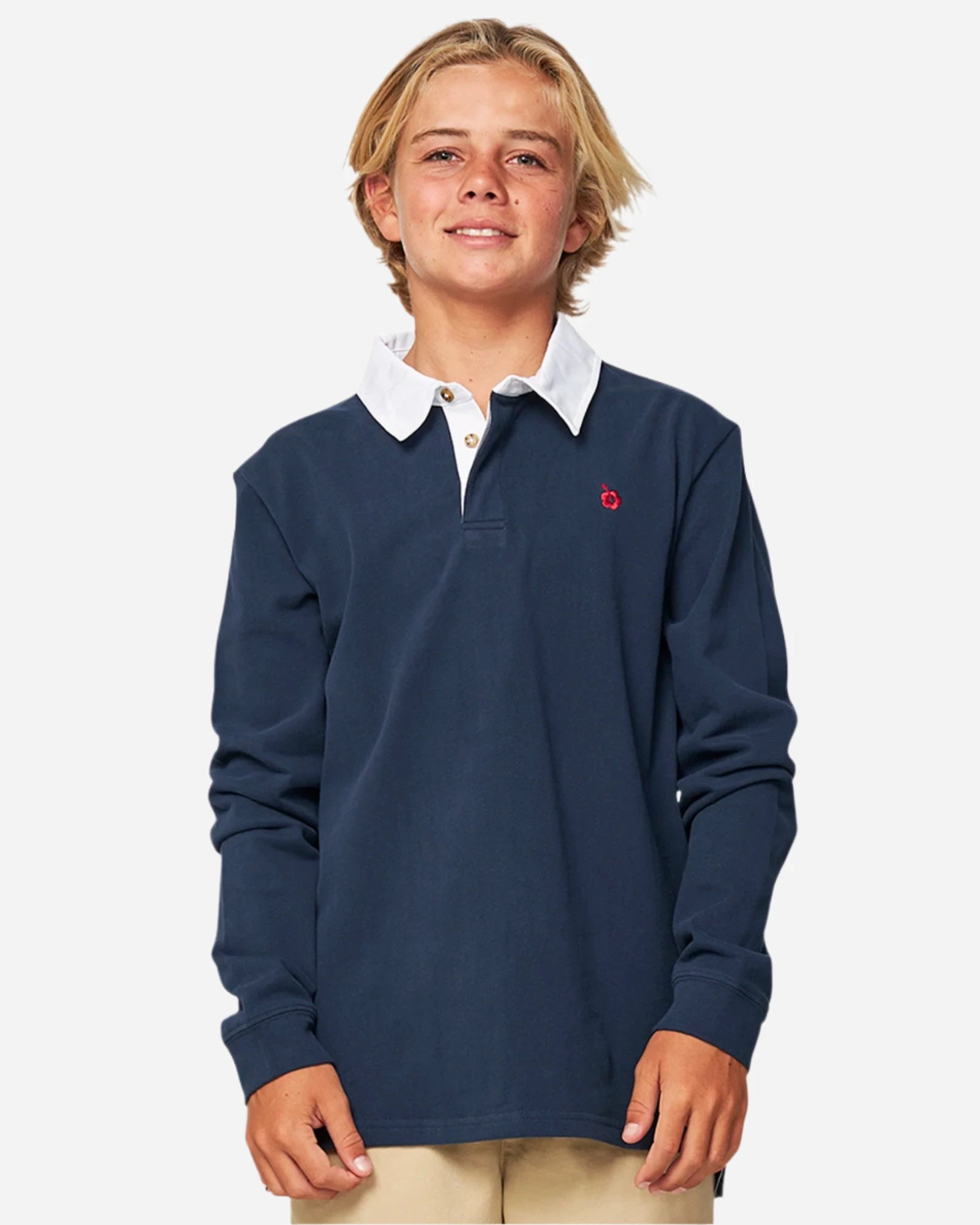 Closeup front view of a boy wearing the Okanui Heritage long sleeve rugby tops and jumpers in Navy