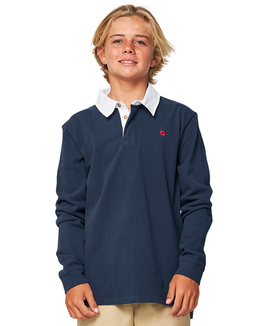 Closeup front view of a boy wearing the Okanui Heritage long sleeve rugby tops and jumpers in Navy