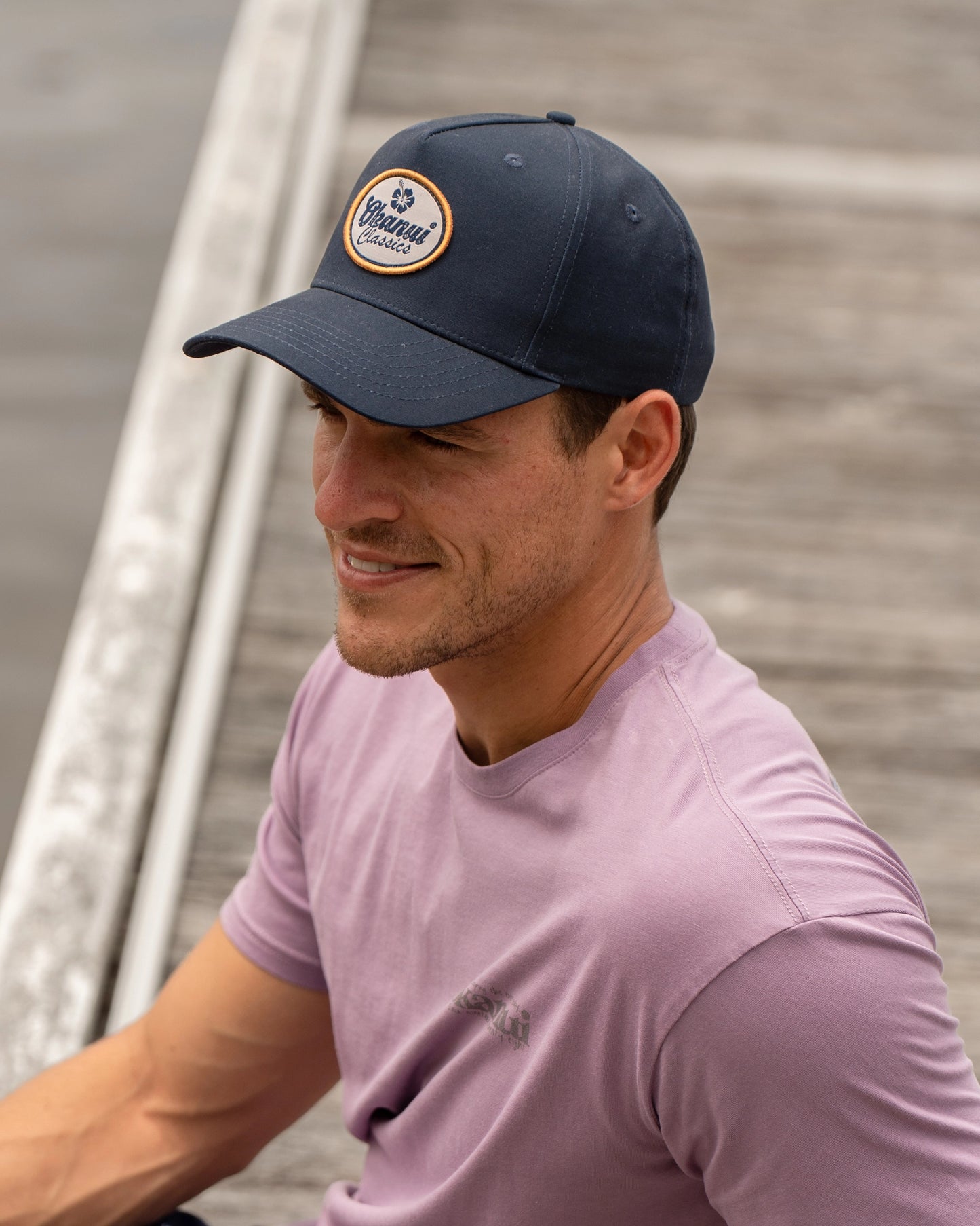 Male model wearing the Navy Okanui Billboard adult snapback trucker cap