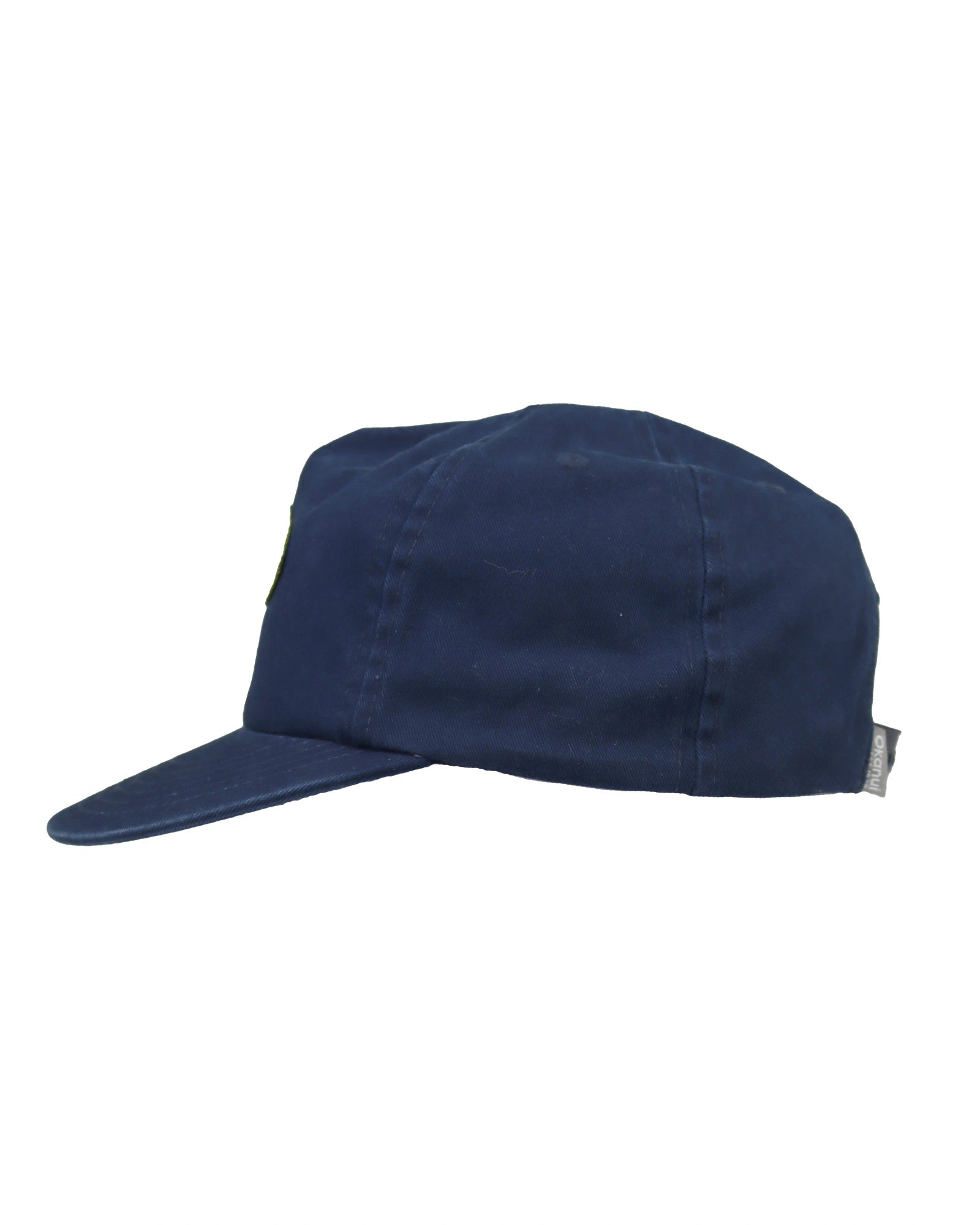 Side view of the Washed Navy Okanui Deck Kids snapback trucker cap