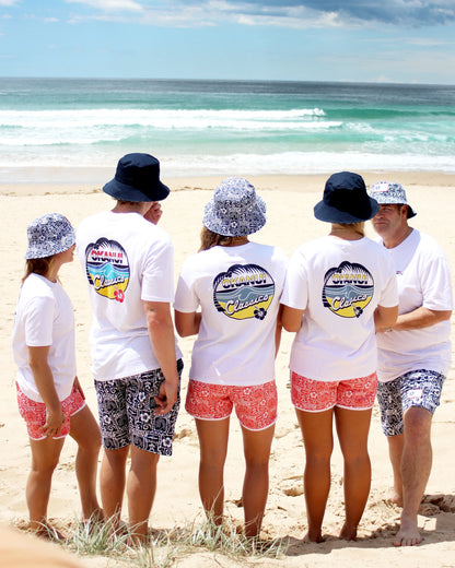 Back view of group of adults in white Okanui shirts wearing the Okanui reversible bucket hat Gotcha4Life