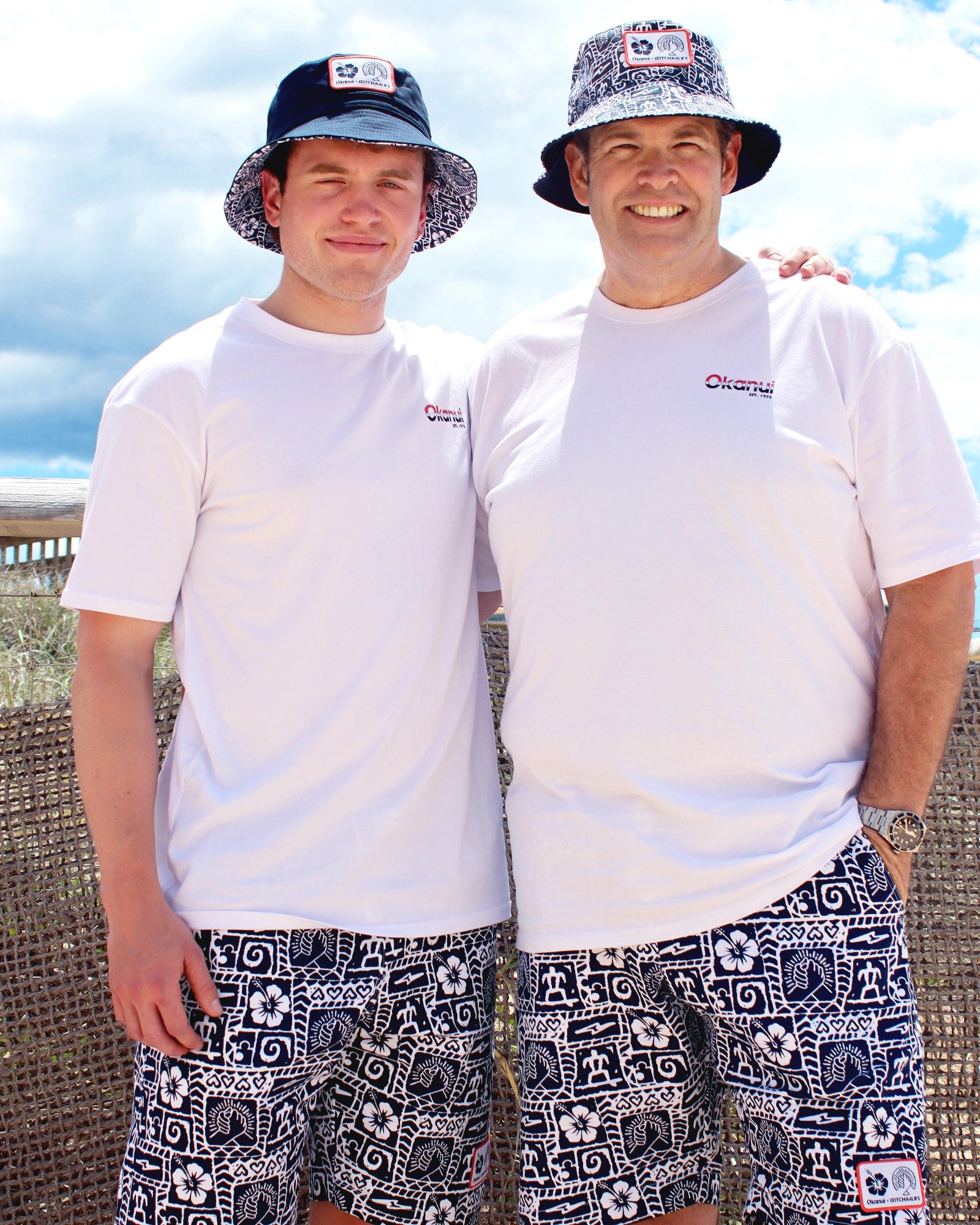 Two adult wearing the Okanui reversible bucket hat Gotcha4Life