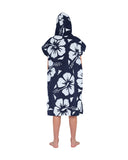 Back view of a kid wearing the Okanui Hooded Towel in Hibiscus Navy color