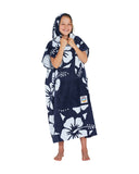Front view of a girl wearing the Okanui Hooded Towel in Hibiscus Navy color