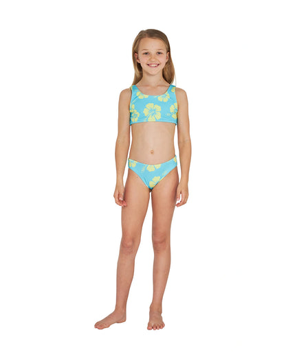 Full body front view of a girl wearing the Okanui crop bikini set in Hibiscus Aqua Yellow