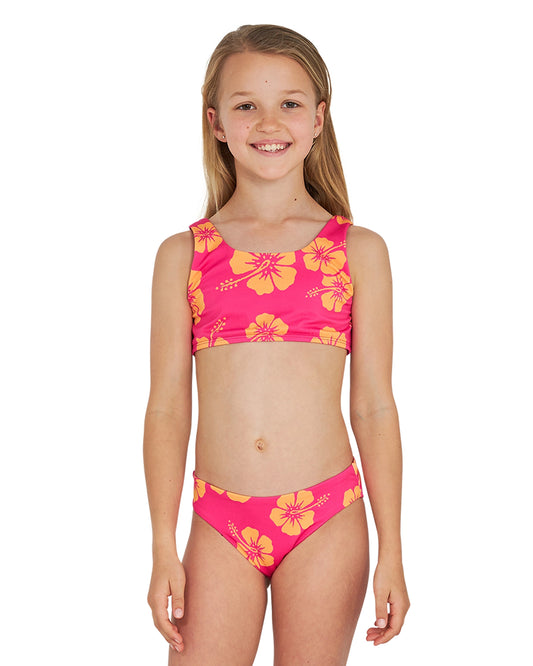 Front view of a girl wearing the Okanui crop bikini set in Hibiscus Pink Melon