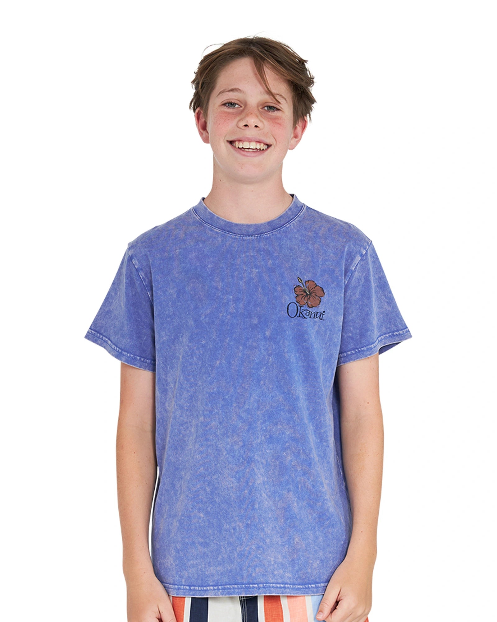 Closeup front view of a boy wearing the Okanui Good Company Tee T-shirt in Washed Blue