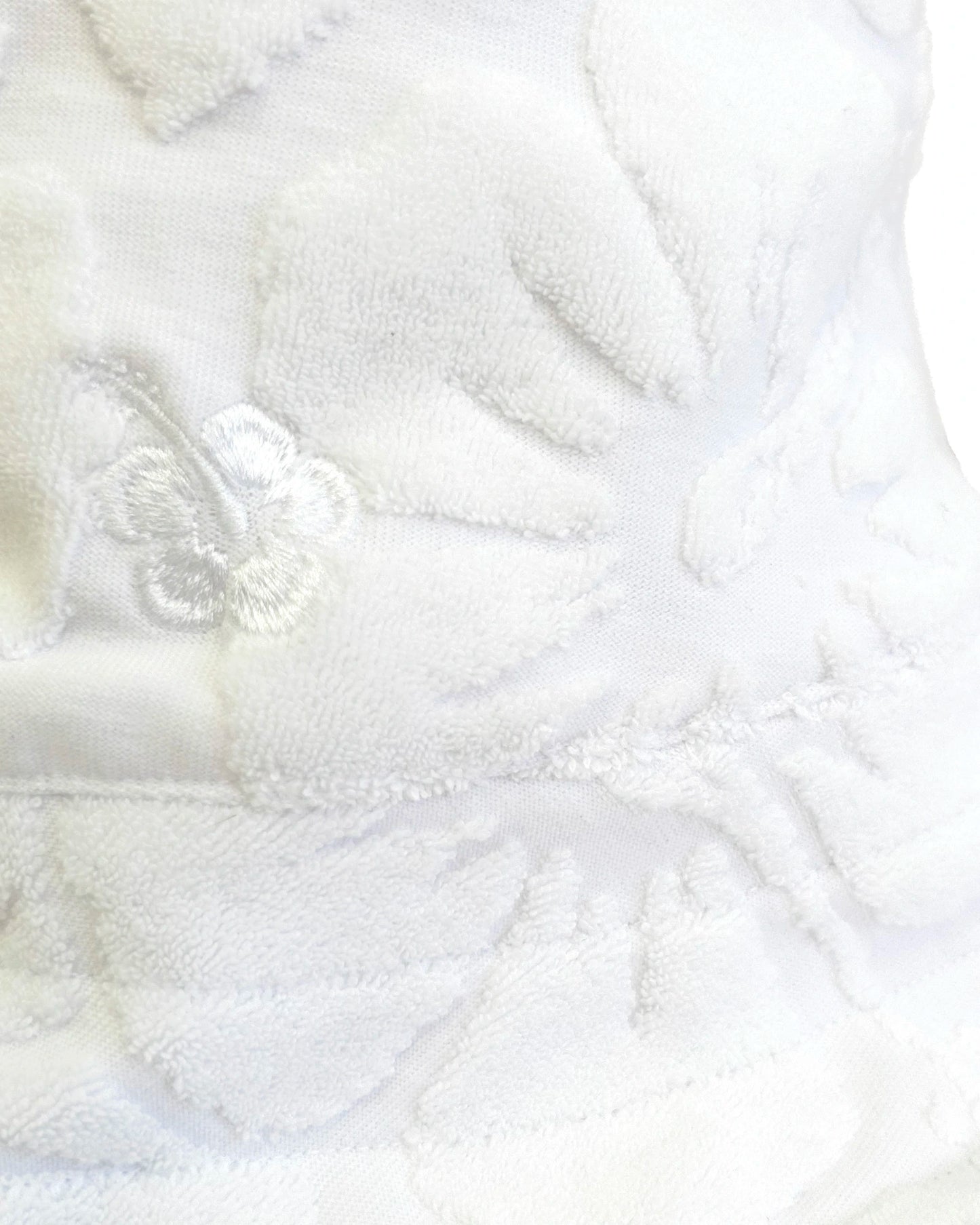 Close up details of Okanui Weekender Terry Bucket Hat Hibisicus White