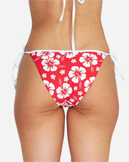 A hibiscus red swim pant with a tie-side design showing the back details.