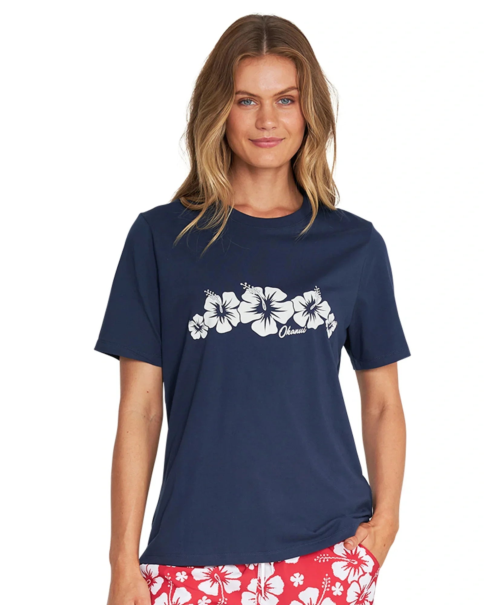 Front view of a female model wearing the Okanui Inline cotton T-shirt in Navy color
