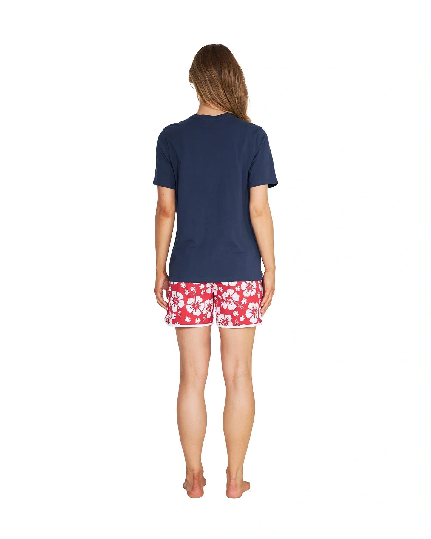 Back view of a female model wearing the Okanui Inline cotton T-Shirt in Navy color