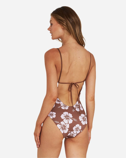 The brown hibiscus flower Okanui summer one-piece reveals the back crossover design.