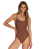 A woman wearing a reversable brown one-piece