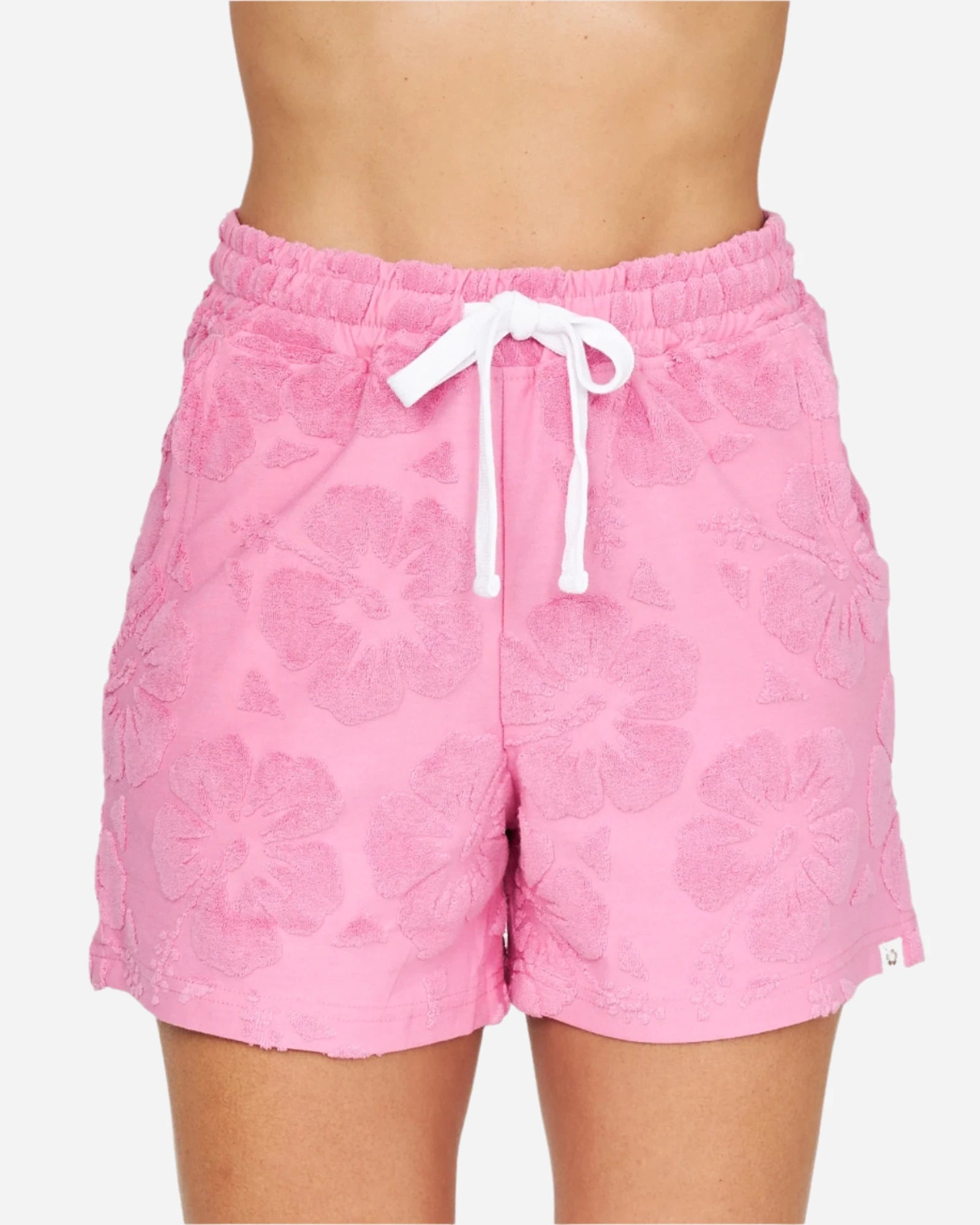 A close up front view of the Okanui Womens Weekender Terry Short in Hibiscus Pink. 