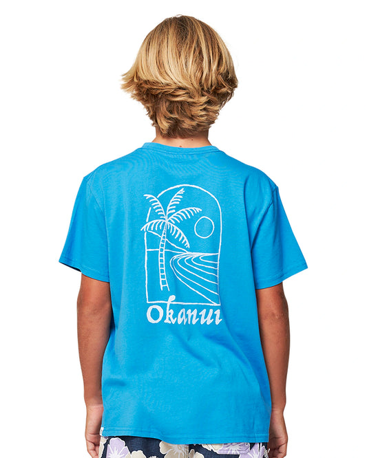 Close up back view of a boy wearing the Okanui Kids Bay Tee T-shirt in Washed Blue