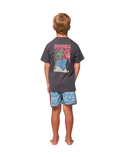 Full body back view of a little boy wearing the Okanui Kids Dazed Iron Tee T-shirt in Washed Black