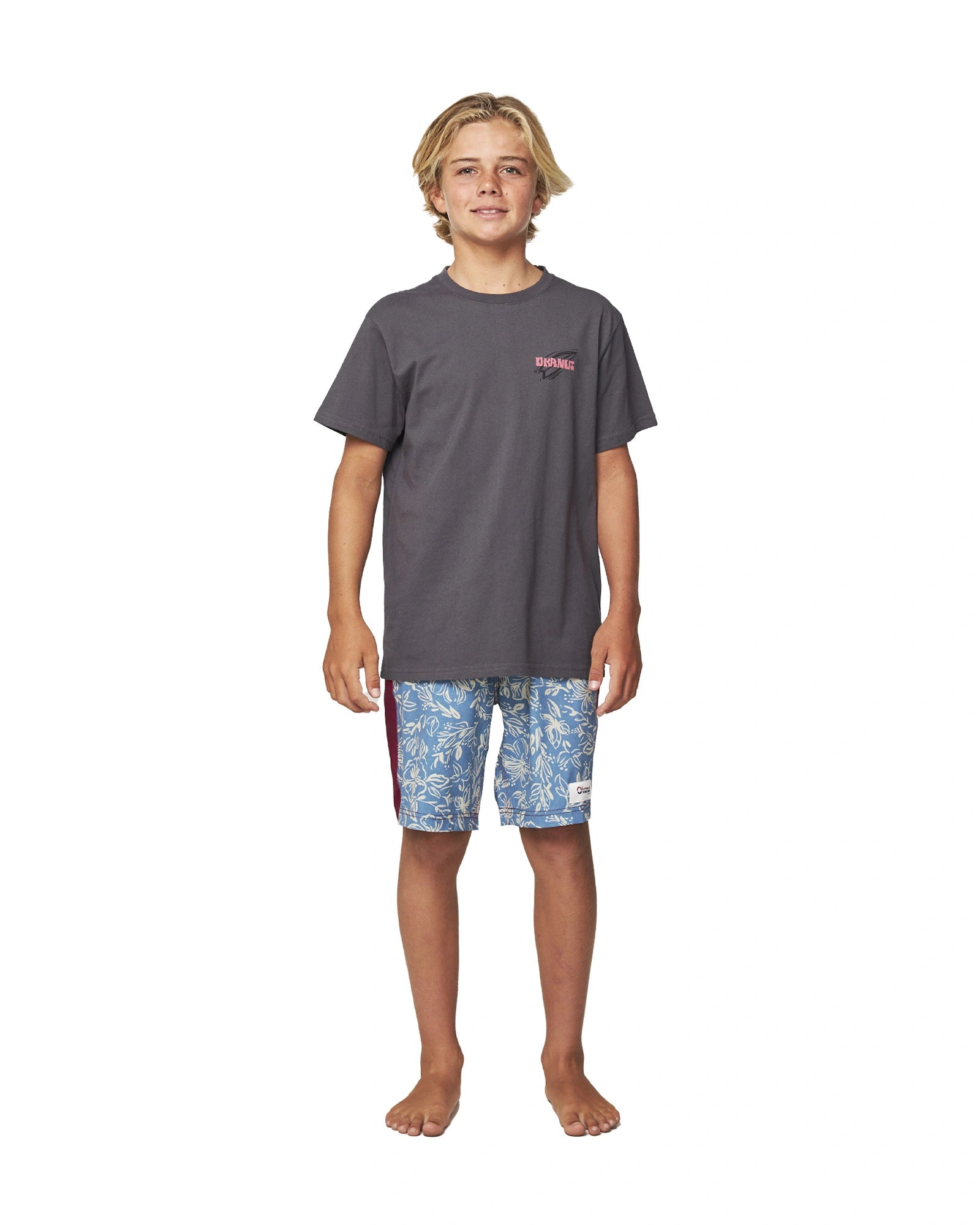 Full body front view of a boy wearing the Okanui Kids Dazed Iron Tee T-shirt in Washed Black