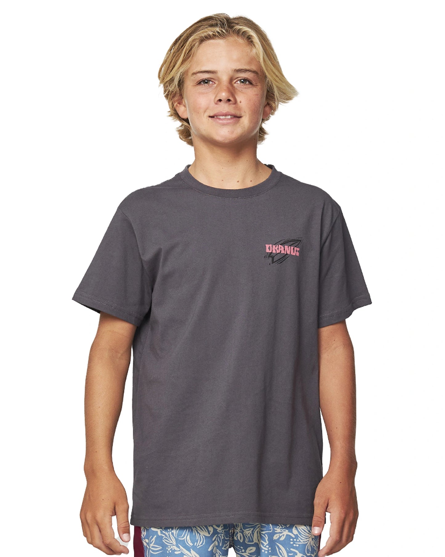 Closeup front view of a boy wearing the Okanui Kids Dazed Iron Tee T-shirt in Washed Black