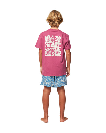 Full body back view of a boy wearing the Okanui Kids swim shorts in Steel