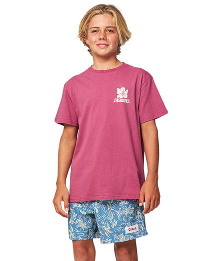 Close up front view of a boy wearing the Okanui Kids swim shorts in Steel