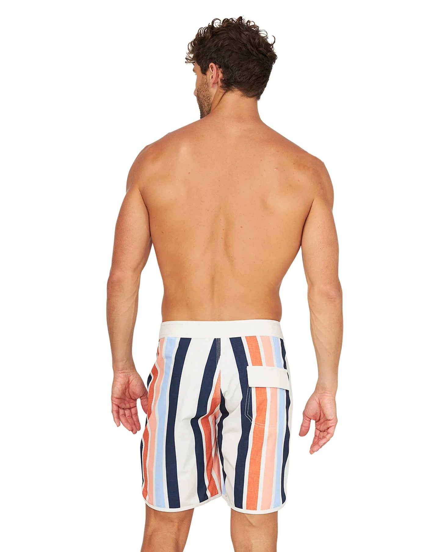 Back view of a shirtless male model wearing the Okanui Above Board Retro Boardrider Boardshort in Birch Multi.