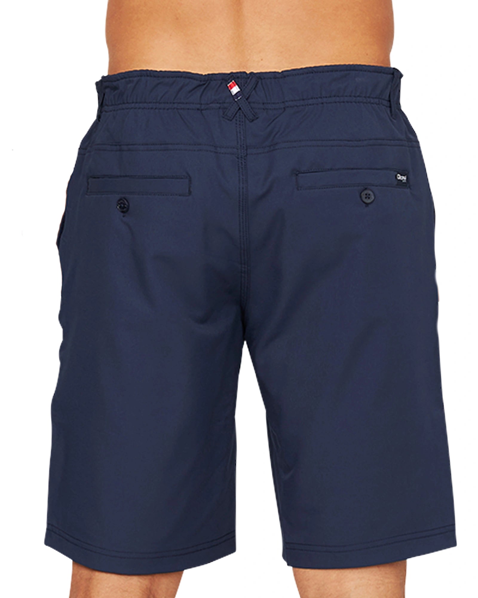 A side view of the Okanui Active Byrd Golf Shorts in navy featuring twin back pockets.