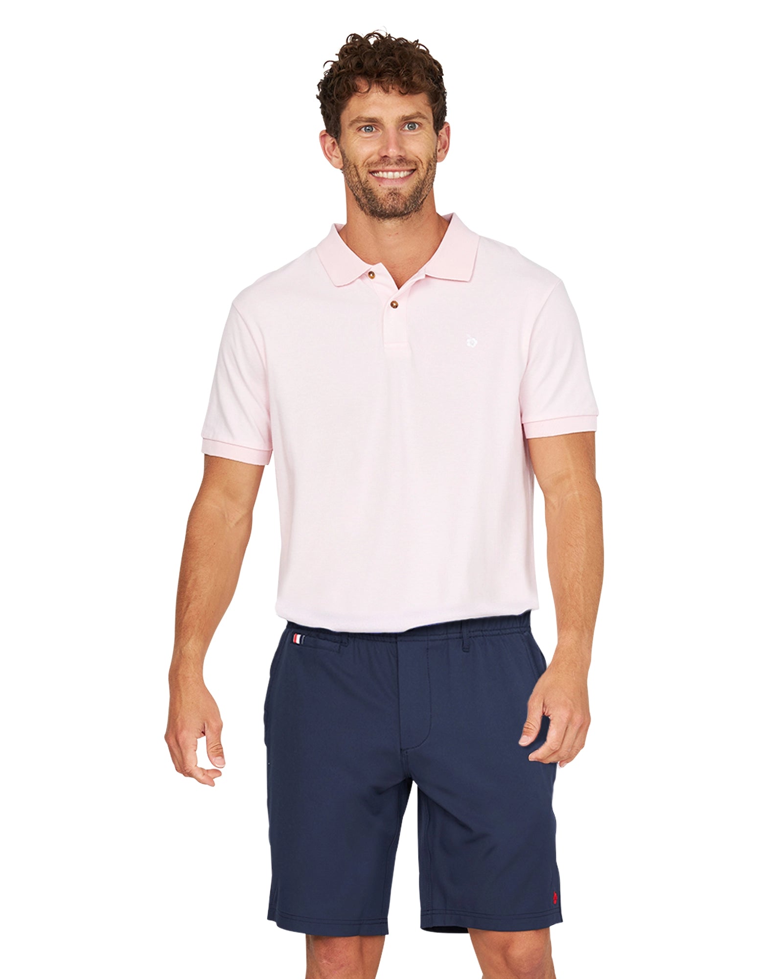 A closer view of a male model wearing the Okanui Active Byrd Golf Shorts in navy.