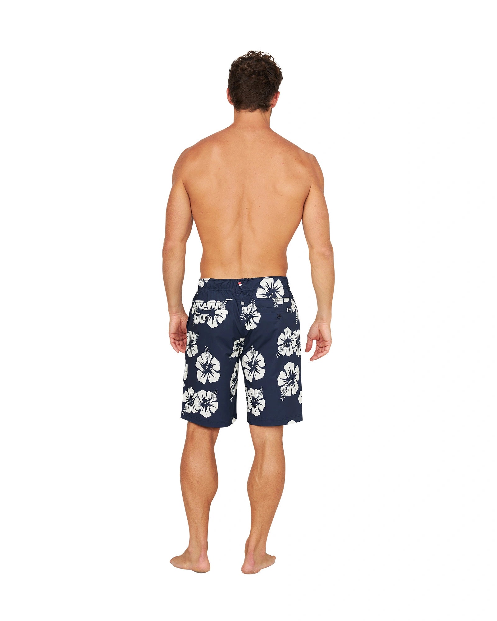 Full back view of a shirtless male model wearing the Okanui Active Byrd Golf Shorts in navy stone color.