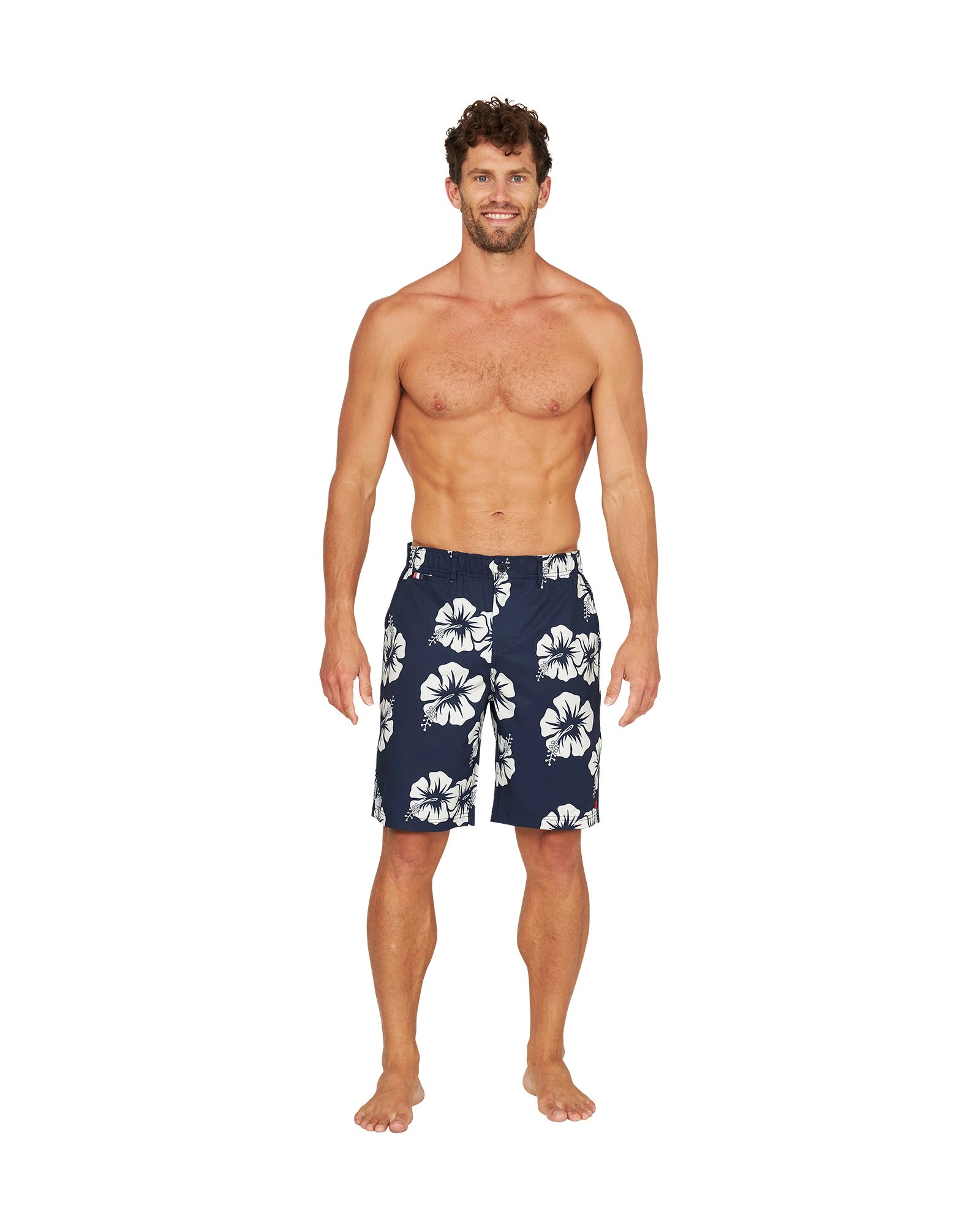 Full front view of a shirtless male model wearing the Okanui Active Byrd Golf Shorts in navy stone color.