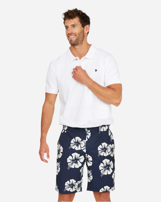 A male model wearing the Okanui Active Byrd Golf Shorts in navy stone color.