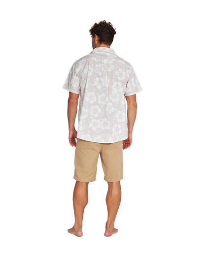 Full body back view of a male model wearing the Okanui Classic Button up short sleeve shirt in Hibiscus Stone