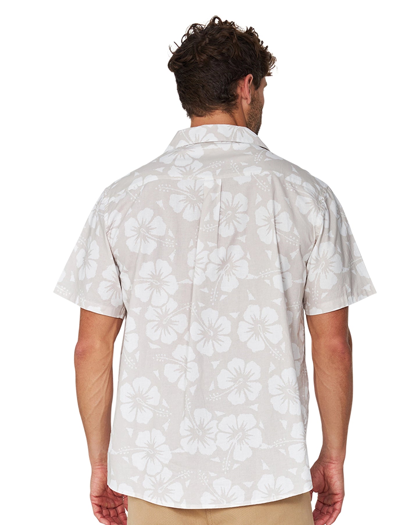 Close up back view of a male model wearing the Okanui Classic Button up short sleeve shirt in Hibiscus Stone