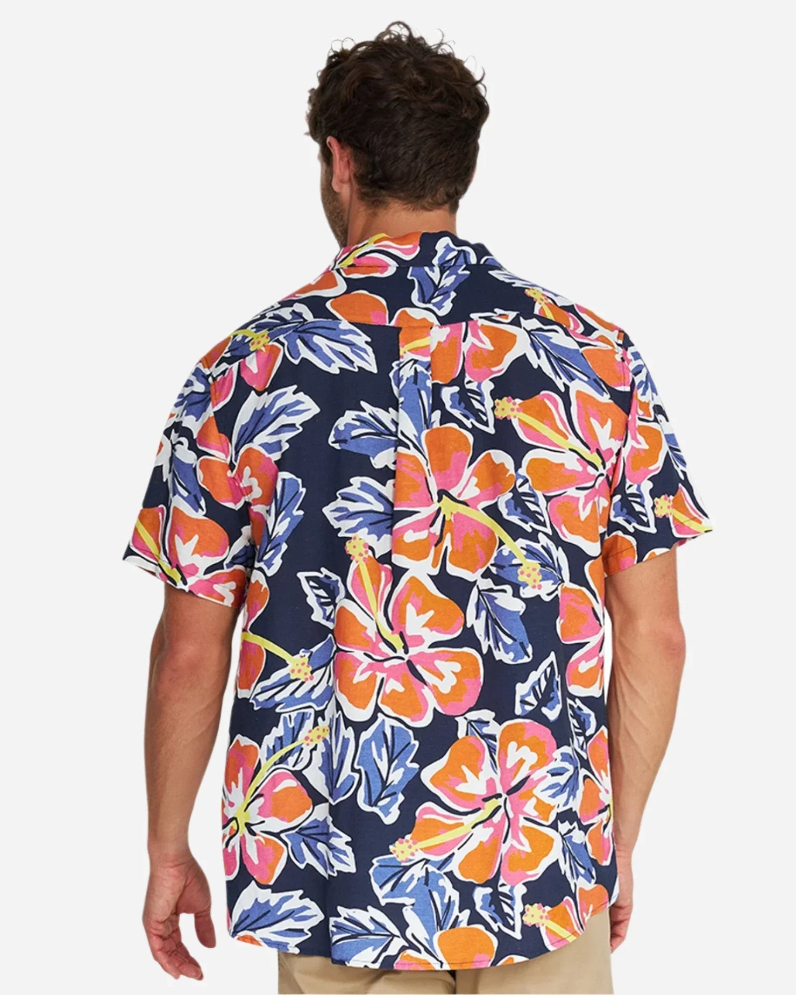 Closer back view of a male model wearing the Okanui Rhapsody Aloha Short Sleeve Shirt in navy multi.