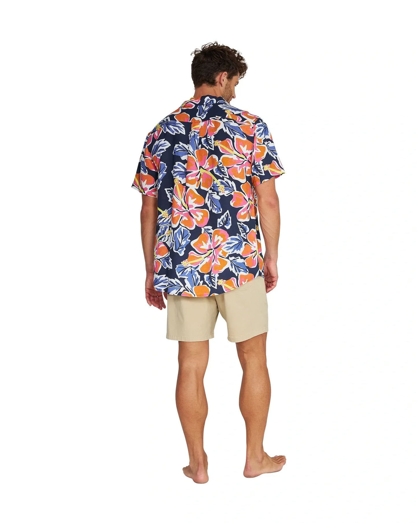 Full body back view of a male model wearing the Okanui Rhapsody Aloha Short Sleeve Shirt in navy multi.