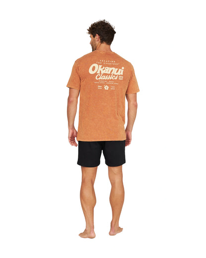 Full back view of a male model wearing the Okanui Big Screen T-Shirt in rust color.