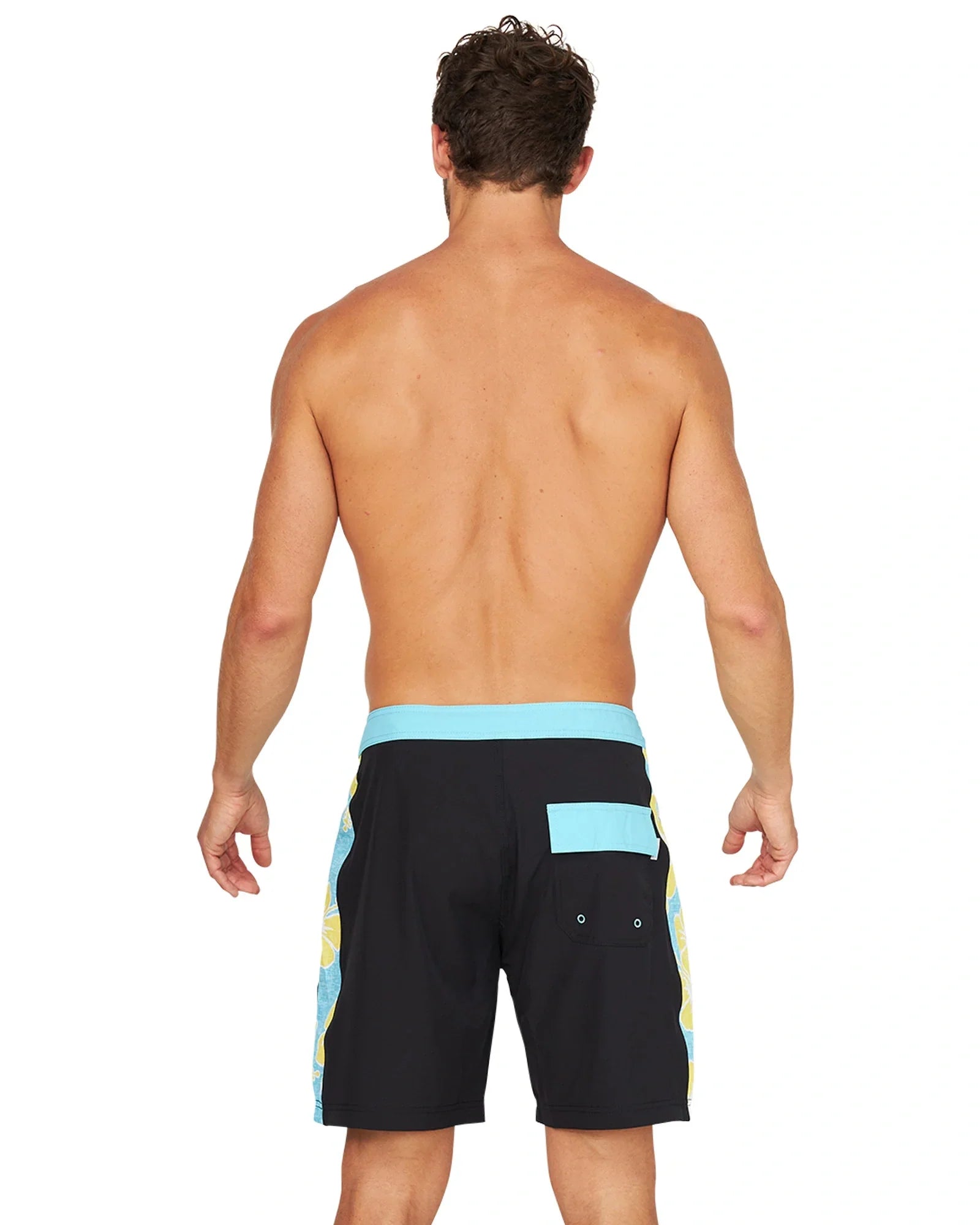 Back view of a shirtless male model wearing the Okanui Sidelines Boardrider Boardshort in Black