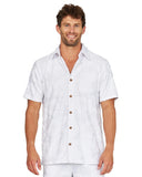 A male model wearing the Okanui Starboard Short Sleeve Shirt in Hibiscus white.