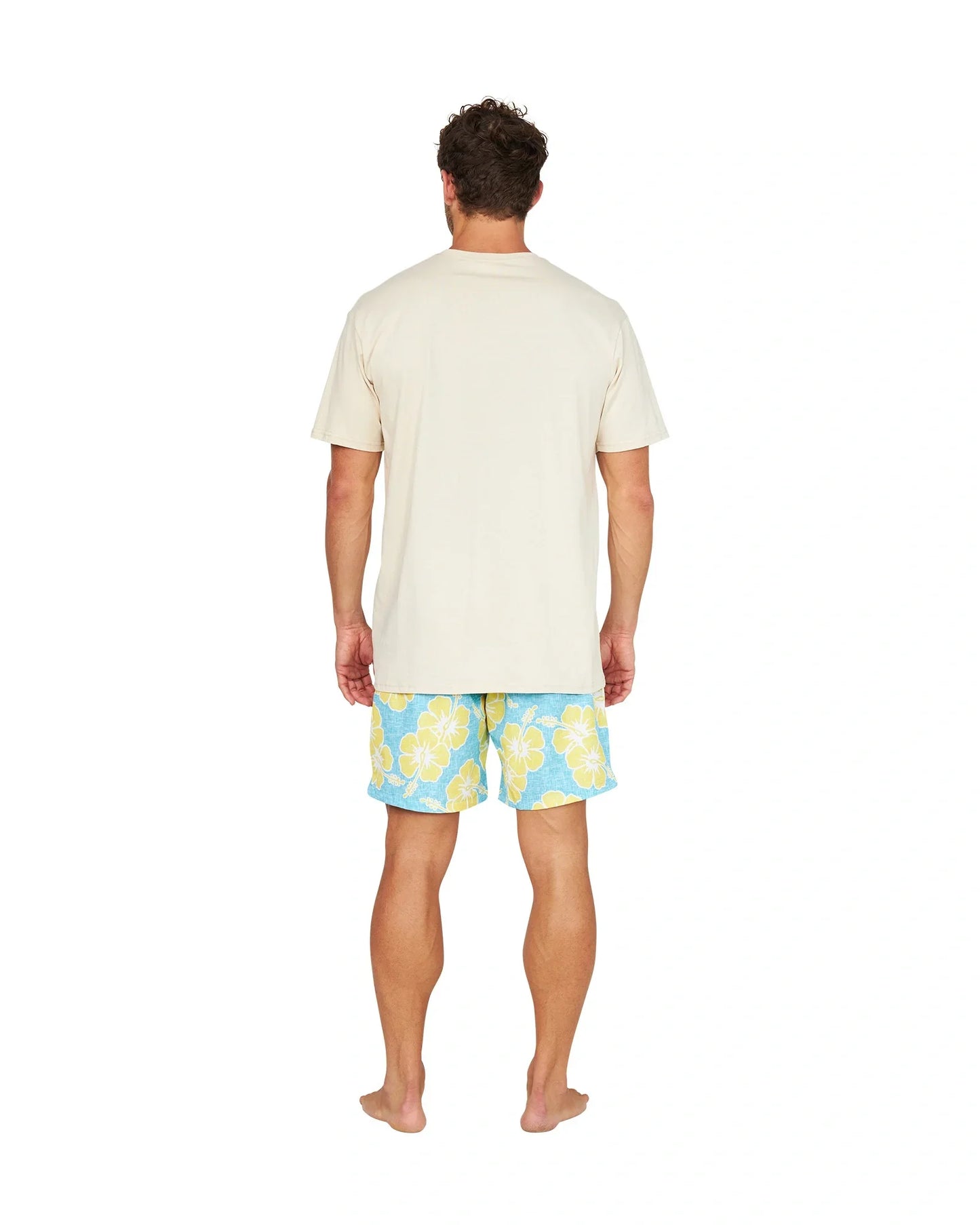 A full back view of a male model wearing the Okanui Way Back When Stretch Swim Short in Aqua Yellow and a birch Okanui Logo Tee.
