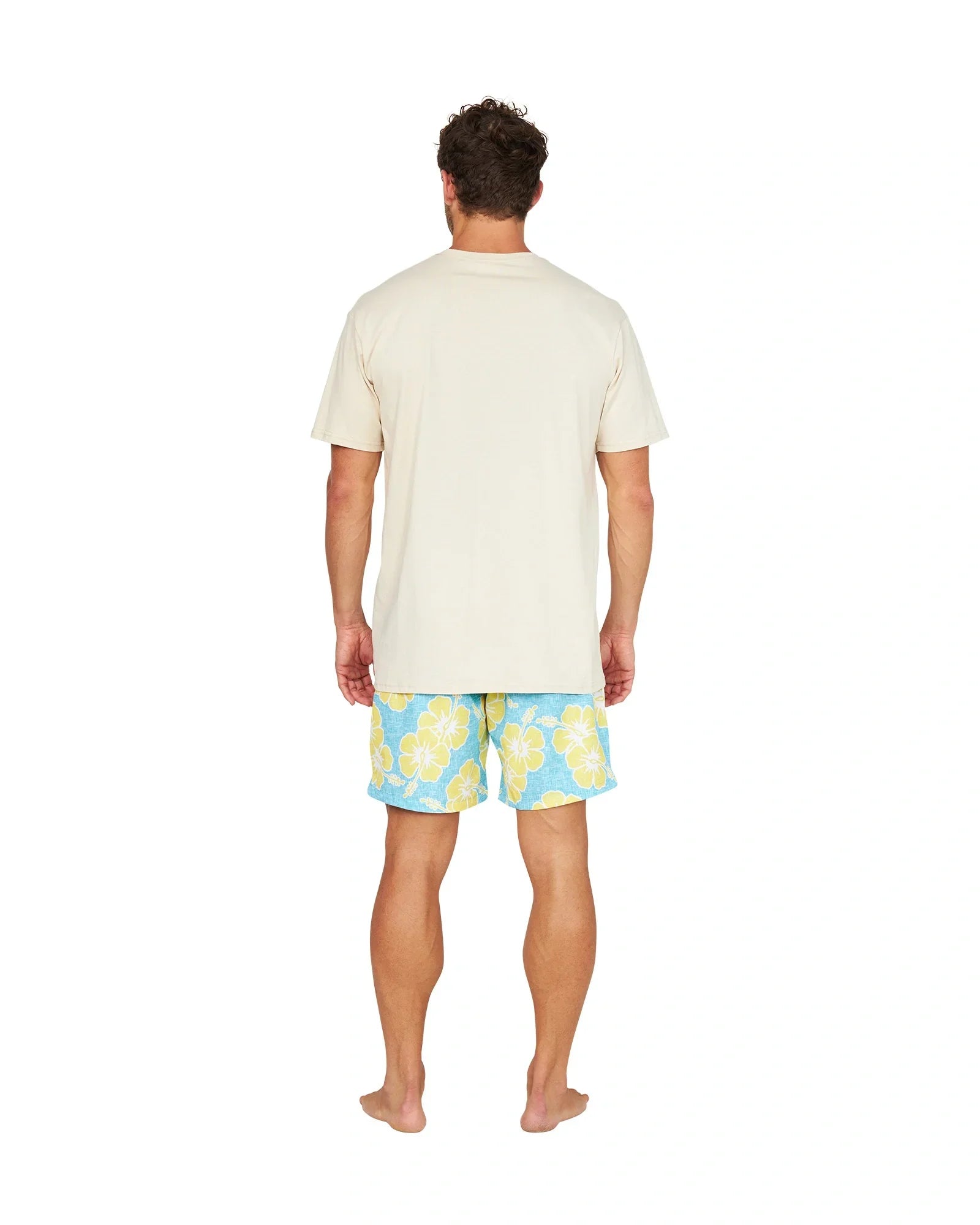 A full back view of a male model wearing the Okanui Way Back When Stretch Swim Short in Aqua Yellow and a birch Okanui Logo Tee.