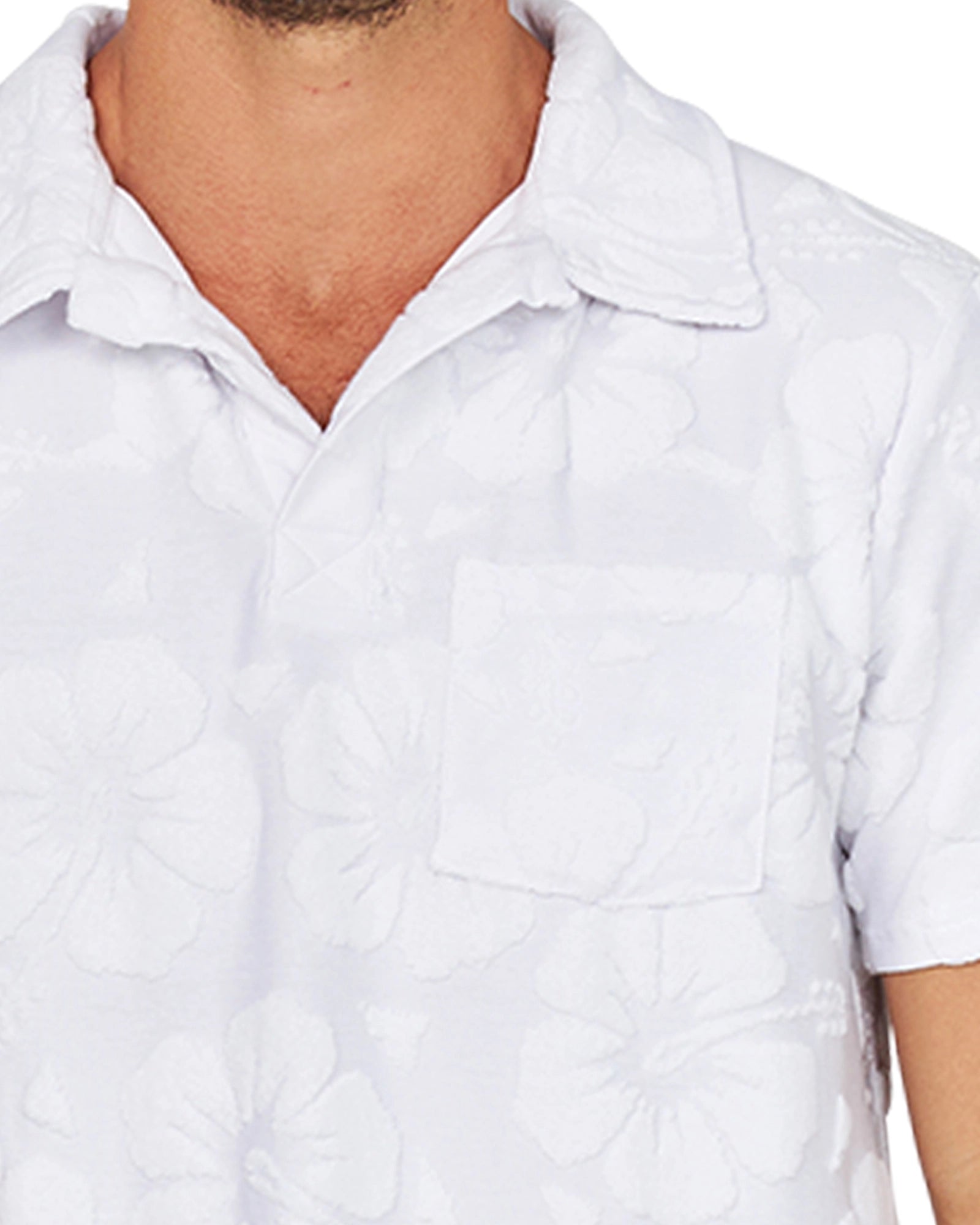 A close up of the collar of the Okanui Weekend Terry Jacquard Polo in Hibiscus White.