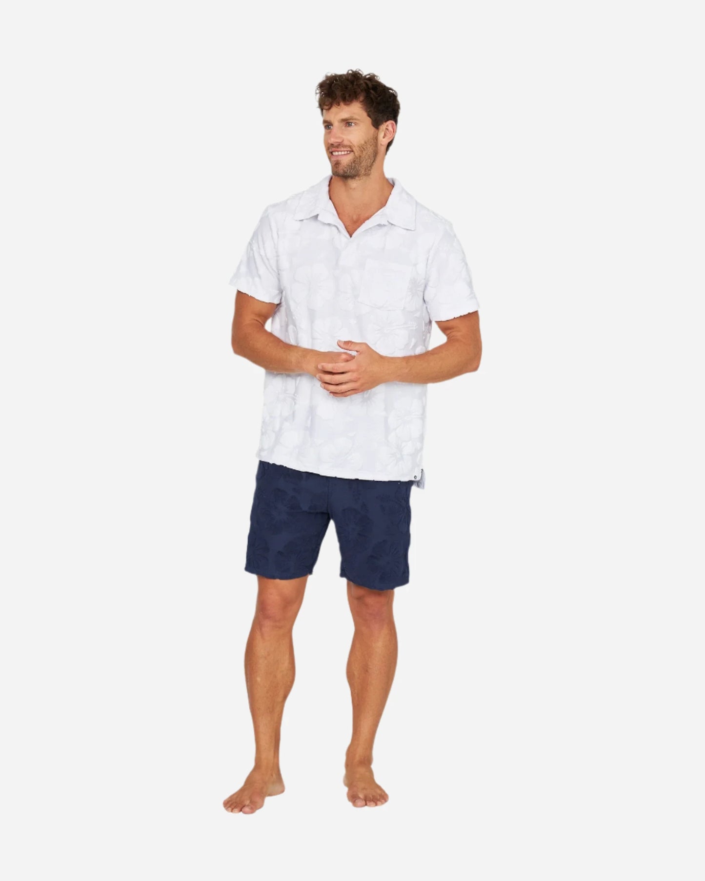 Full body view of the Okanui Weekend Terry Jacquard Polo in Hibiscus White.