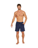 A fit male model wearing the Okanui Weekend Terry Jacquard Walk Shorts in navy color with his hand in the left side pocket.
