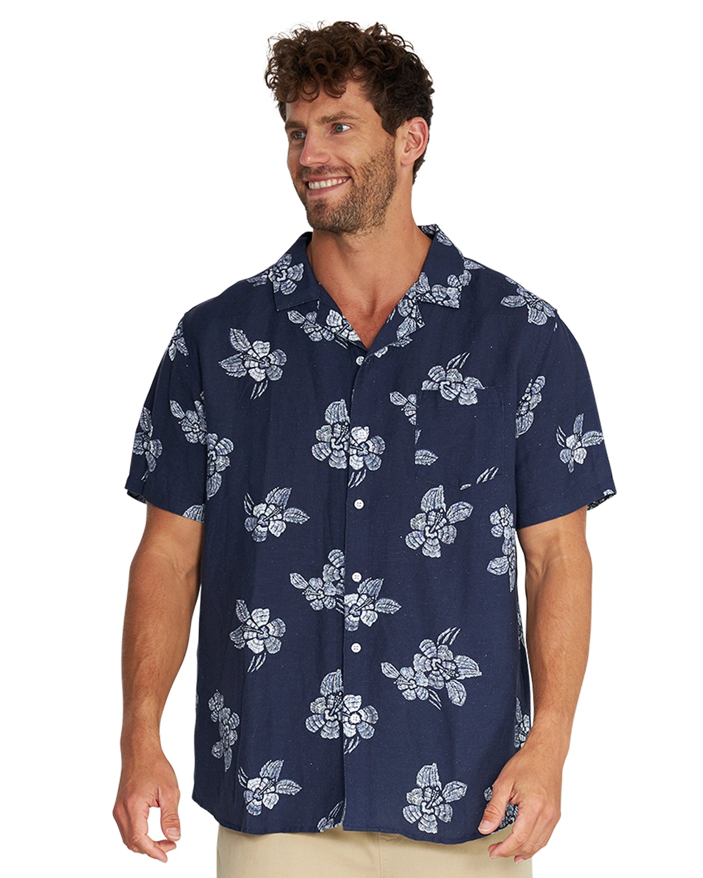 A male model wearing the Okanui Whitewater Aloha Short Sleeve Shirt in navy color.