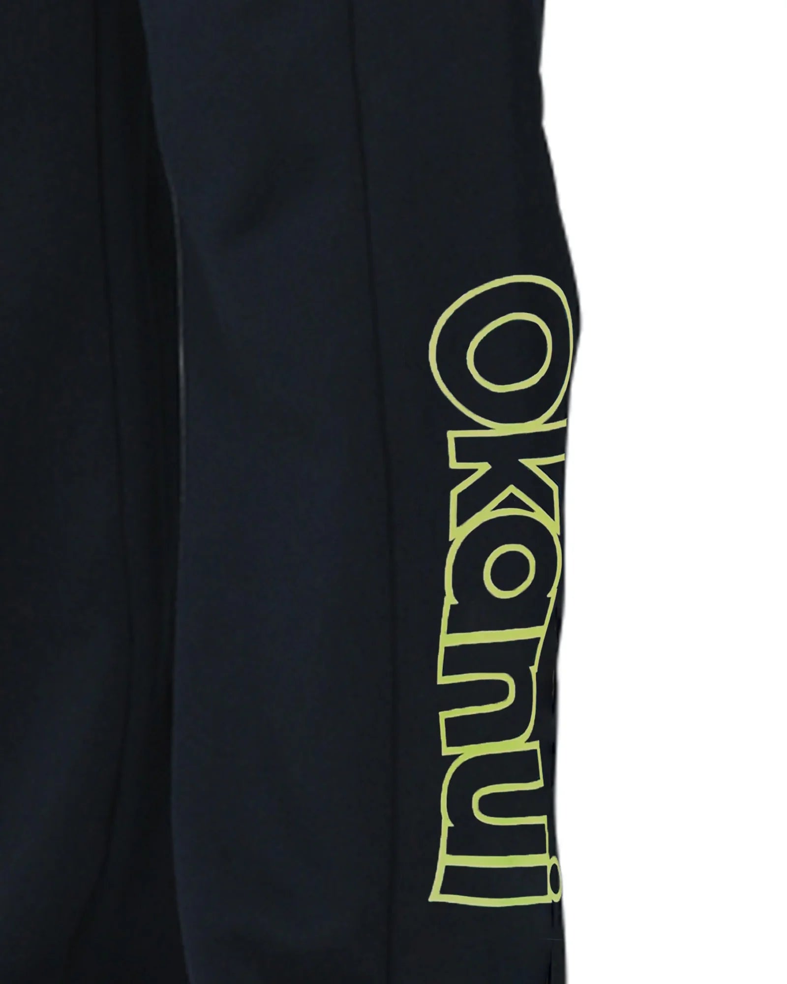 Closeup view of the Okanui Winter Keyline trackies for Kids in Navy color showing the Okanui logo
