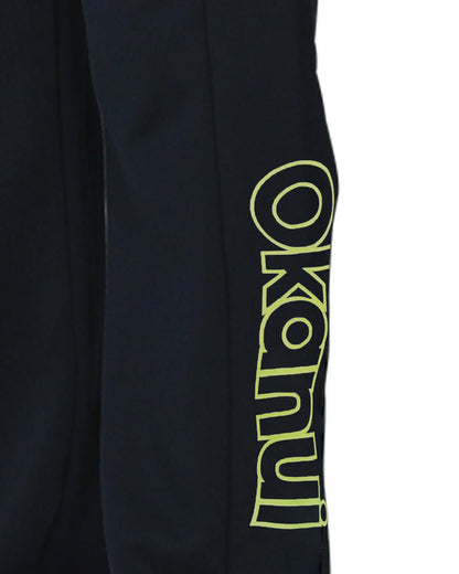 Closeup view of the Okanui Winter Keyline trackies for Kids in Navy color showing the Okanui logo