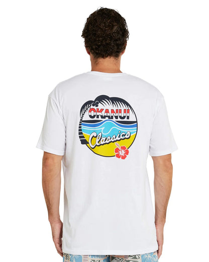 Back view of a model wearing the Okanui Classic Badge T-shirt showing the back print of the t-shirt.