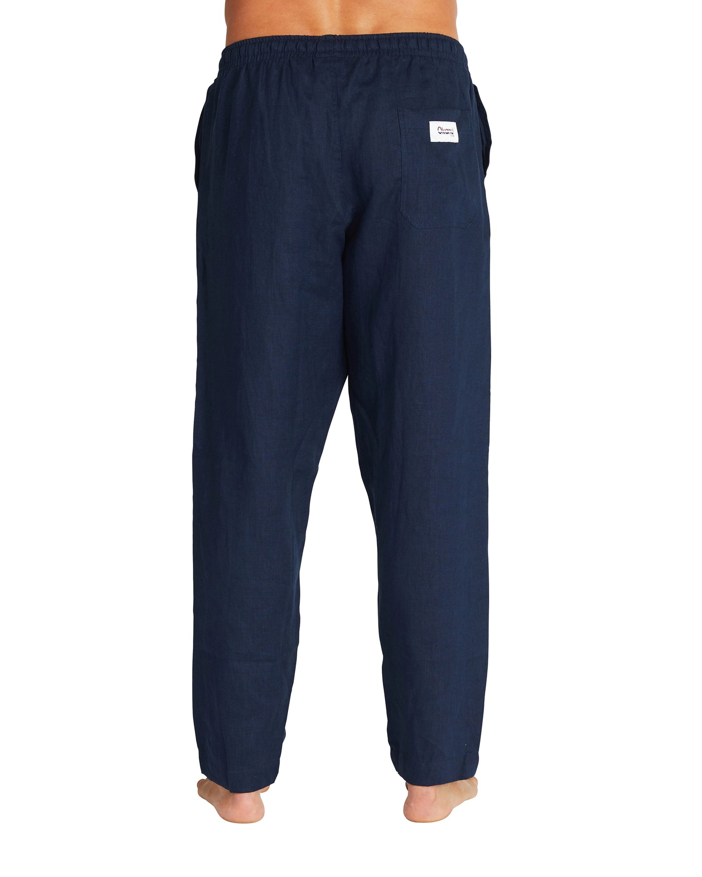 A back view of the Okanui linen pants in navy color with a loose fit.